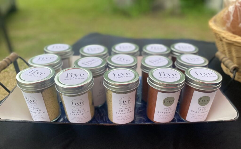 jars of seasoning in a tray

